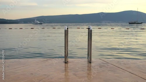 luxury vacation, stairs to the lake among the mountains