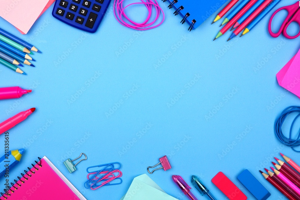 School supplies frame against a pastel blue paper background. Pink ...