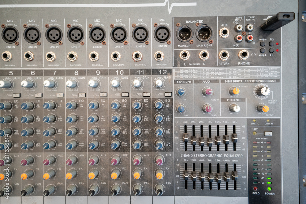 Sound technician audio mixer equalizer control for background.