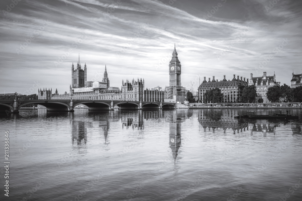 Vintage picture of Big Ben and Westminster parliament with water reflection