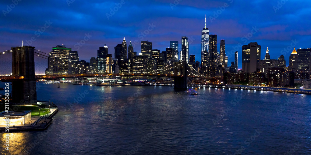 JUNE 2, 2018 - NEW YORK, NEW YORK, USA  - New York City and East River shows Brooklyn Bridge and Manhatten Skyline  as seen from Queens