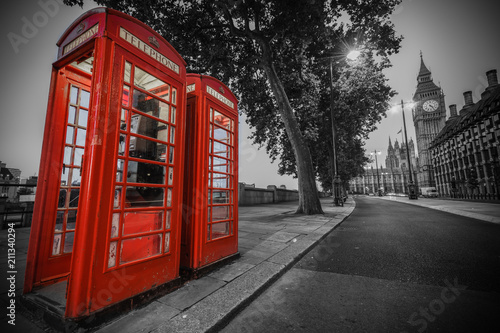 Traditional red phone booth in London with the Big Ben in the background © Pawel Pajor