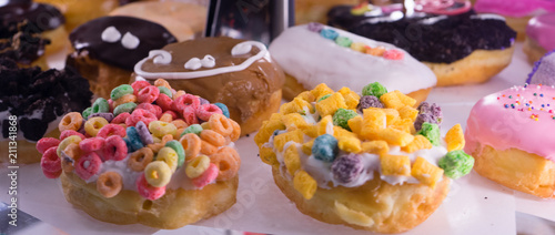 fancy and colorful doughnuts with many kinds of topping