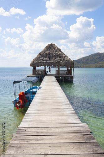 Man jumping off pier in Guatemala © GVictoria