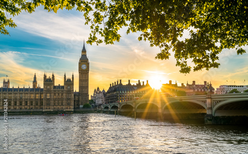 British parliament, Big Ben and Westminster bridge at sunset in London, UK