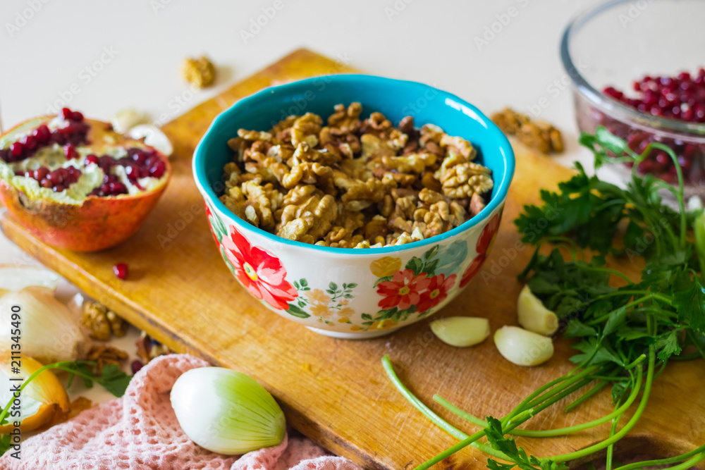 Walnuts in ceramic bowl good for salads, lunch or dinner meal and desserts. Raw vegan vegetarian healthy food. Walnuts in ceramic bowl good for salads, lunch or dinner meal and desserts. Raw vegan vegetarian healthy food.