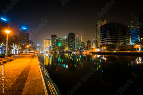 Dubai marina illuminated at night in United Arab Emirates 