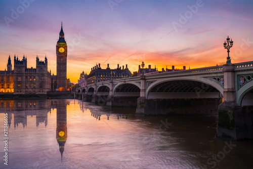 Big Ben with water reflection at beautiful sunset