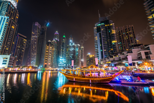 Dubai marina at night viewed from boat pier, UAE