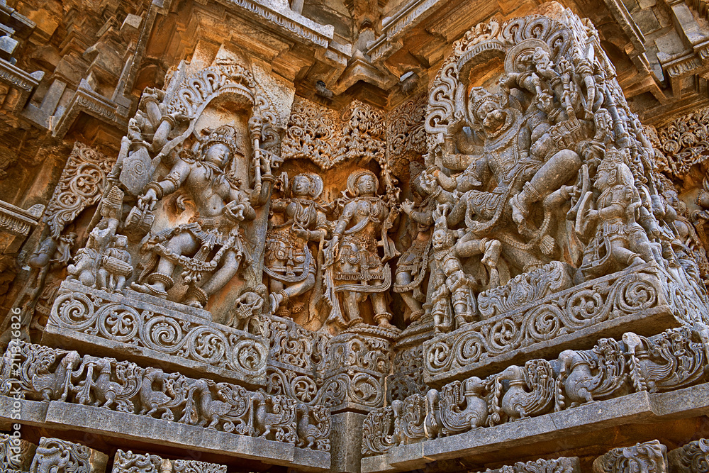 Ornate wall panel reliefs depicting Goddess Kali on the left and Narsimha on the right, Hoysaleshwara temple, Halebidu, Karnataka
