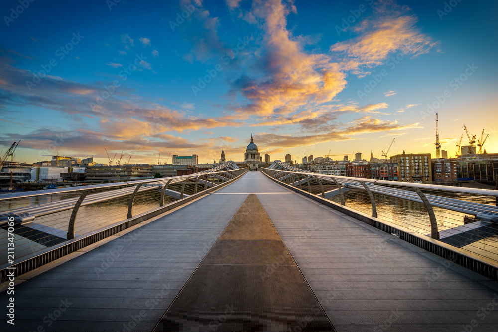 Millenium bridge and St. Paul's Cathedral in London at sunrise