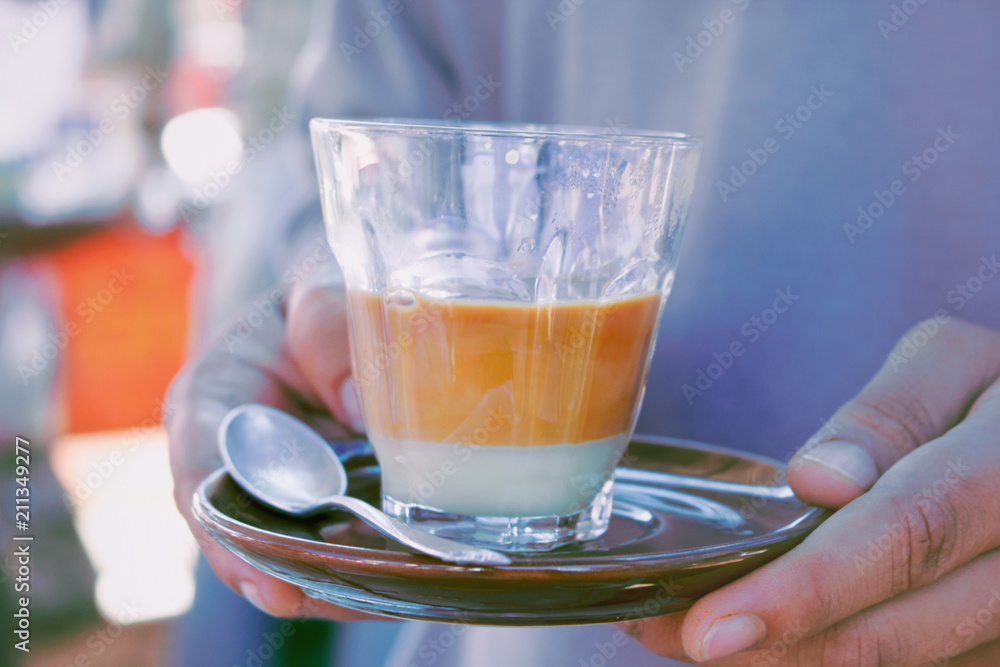Hands of young man served with hot tea Selective focus. Hands of young man served with hot tea Selective focus.
