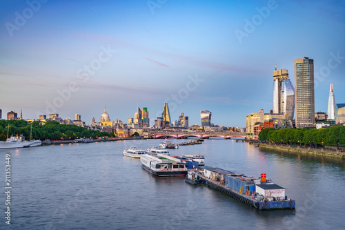 Morning skyline of London viewed across river Thames 