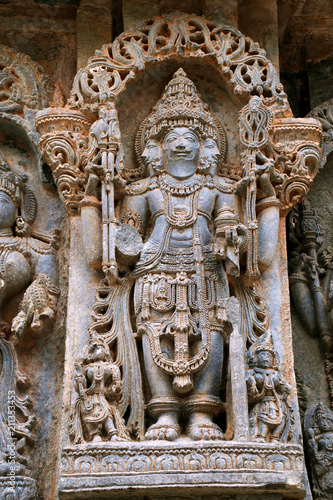 Ornate wall panel reliefs depicting lord Brahma  North wall  Kedareshwara temple  Halebidu  Karnataka