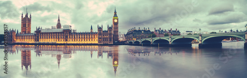 Panoramic view of Houses of Parliament, Big Ben and Westminster Bridge with reflection, London