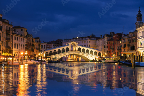 Rialto bridge and Garnd Canal at night in Venice, Italy photo
