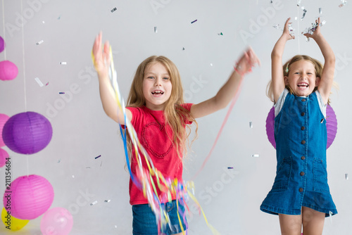 Children birthday party. Play with balloons and confetti