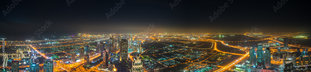 Aerial panorama of Dubai city at night 