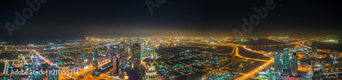 Aerial panorama of Dubai city at night 