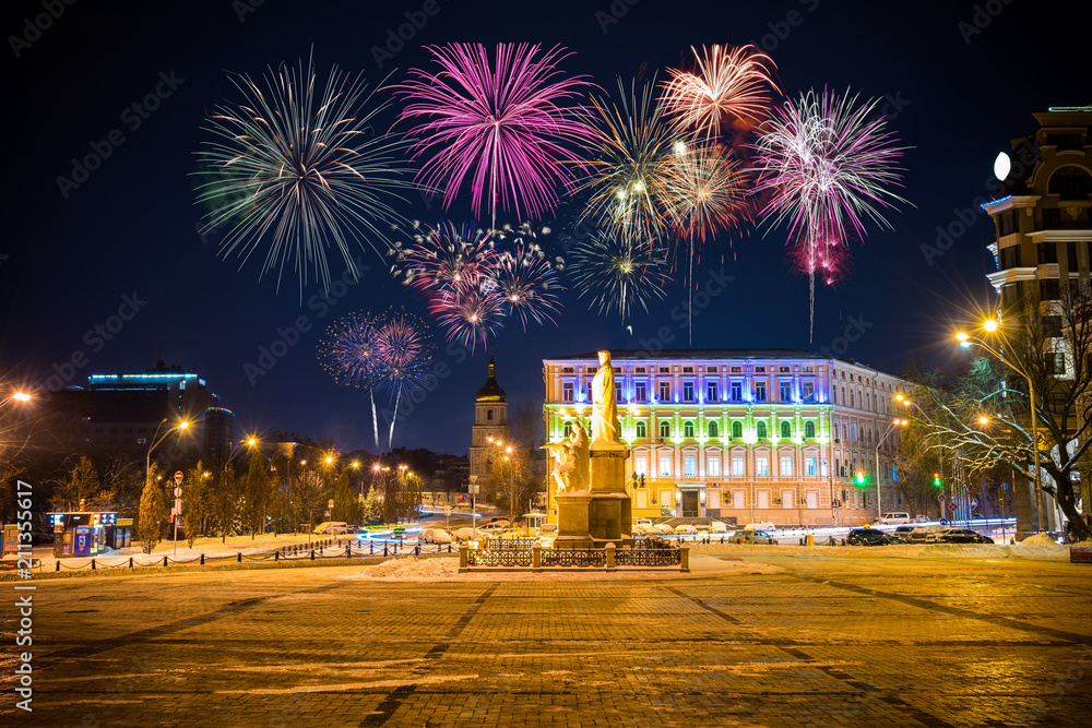 Fototapeta premium Firework display near Princess Olga Monument in Kiev, Ukraine 