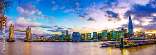 Colorful sunset panorama of Thames river including London landmarks 