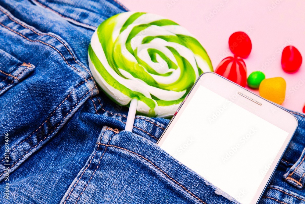 mobile phone blue jeans pocket with candy Stock Photo Adobe Stock