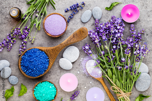 Essential lavender salt with flowers top view.