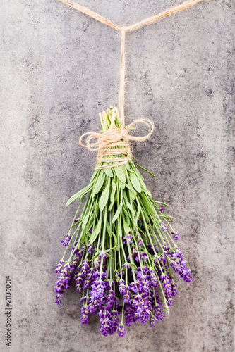 Fototapeta Naklejka Na Ścianę i Meble -  Lavender flowers, bouquet on rustic background, overhead.