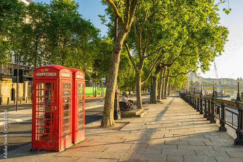 Photography A traditional red phone booth in London at sunny morning