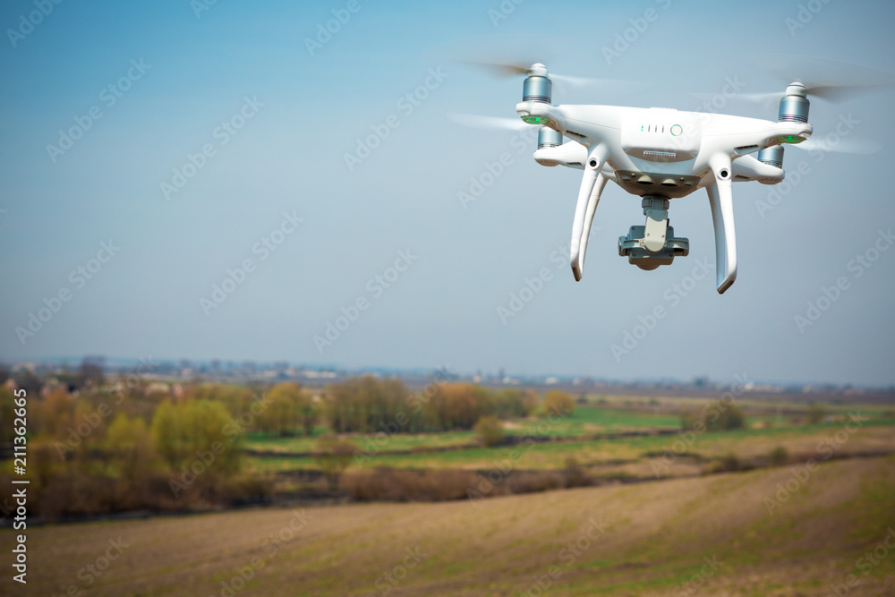 drone quad copter on green corn field drone quad copter on green corn field
