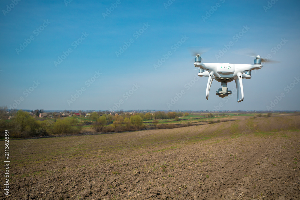drone quad copter on green corn field drone quad copter on green corn field
