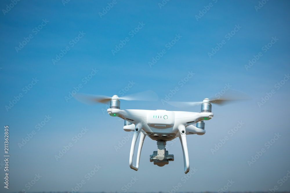 drone quad copter on green corn field drone quad copter on green corn field