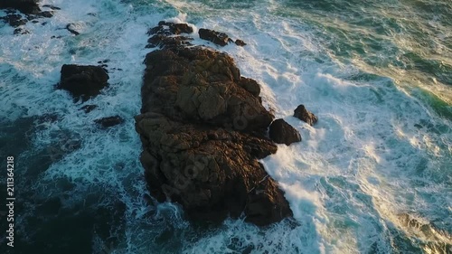 waves crashing over rocks