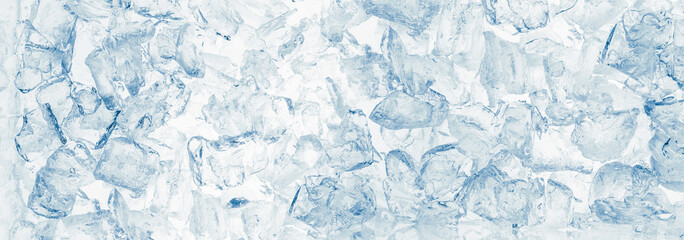 Ice cubes blue wide background.