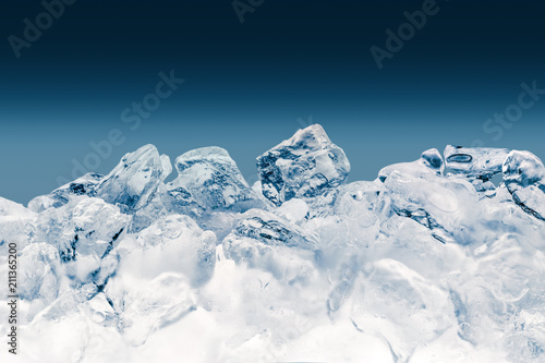 Pieces of crushed ice cubes on blue background. Clipping path included