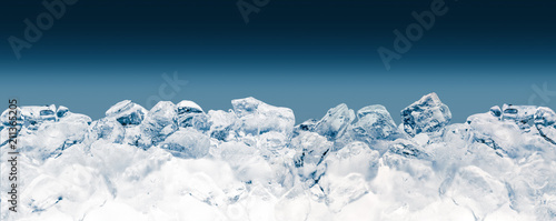 Pieces of crushed ice cubes on blue background. Clipping path included.