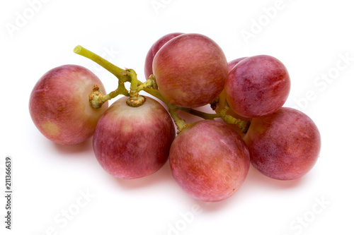 Ripe red grape isolated on white.