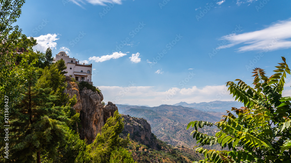 Fototapeta premium beautiful view of the mountains in the region of Andalusia, houses and farmland on the slopes of mountains