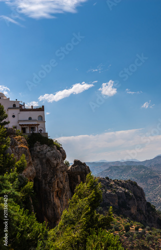 beautiful view of the mountains in the region of Andalusia, houses and farmland on the slopes of mountains