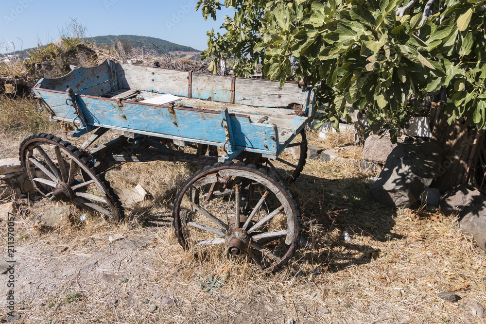 An old and disused blue carriage in a village in Cunda, Ayvalik, Turkey