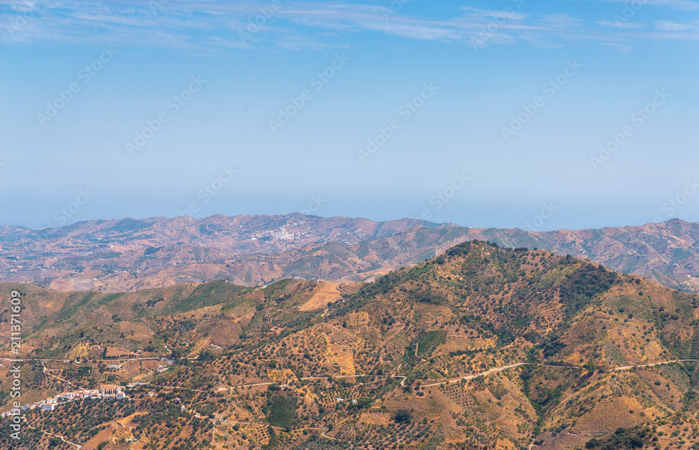 beautiful view of the mountains in the region of Andalusia, houses and farmland on the slopes of mountains beautiful view of the mountains in the region of Andalusia, houses and farmland on the slopes of mountains