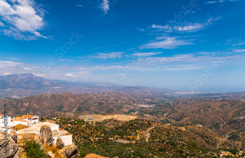 beautiful view of the mountains in the region of Andalusia, houses and farmland on the slopes of mountains © Q77photo