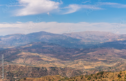 beautiful view of the mountains in the region of Andalusia, houses and farmland on the slopes of mountains © Q77photo