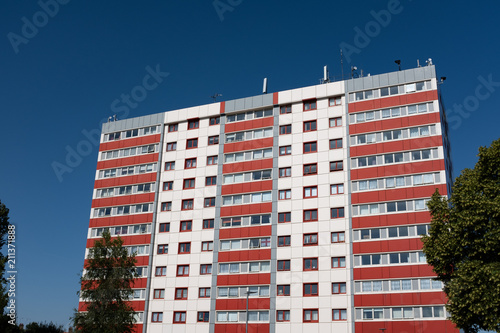 council tower block with red and white cladding