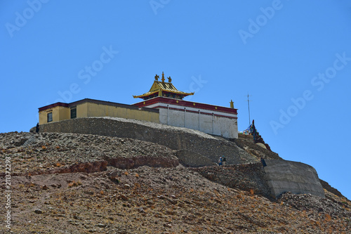 China, Tibet, Chiu Gompa monastery on a hill on the shore of lake Manasarovar photo