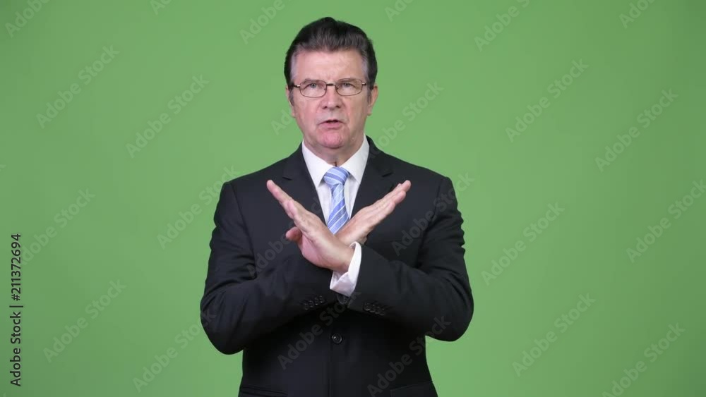 Senior handsome businessman gesturing stop Senior handsome businessman gesturing stop