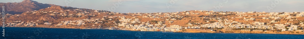 Panorama of Mykonos city in Greece viewed from the sea at sunset 