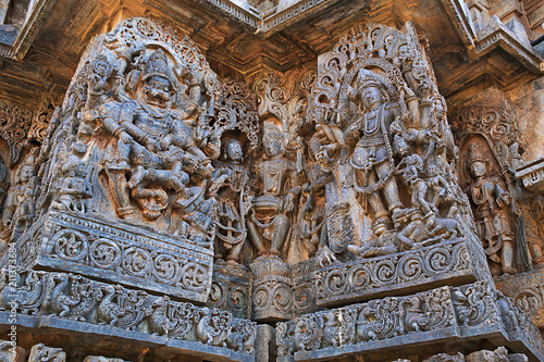 Sculpture of Narsimha on the left and goddess Kali on the right, west side walls, Hoysaleshwara temple, Halebidu, Karnataka. view from West. photo
