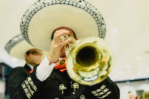 Photos Mexican musician with his trumpet and guitars