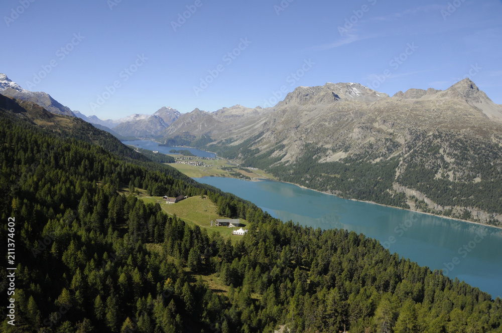 Magnificant swiss alp panoramic view from mount Corvatsch to the glacier lakes of the valley of Oberengadin
